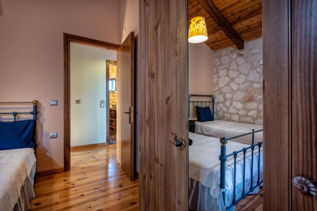 Postel nebo postele na pokoji v ubytování ORFEAS Villa