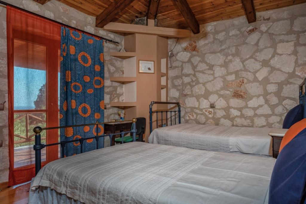 Postel nebo postele na pokoji v ubytování ORFEAS Villa