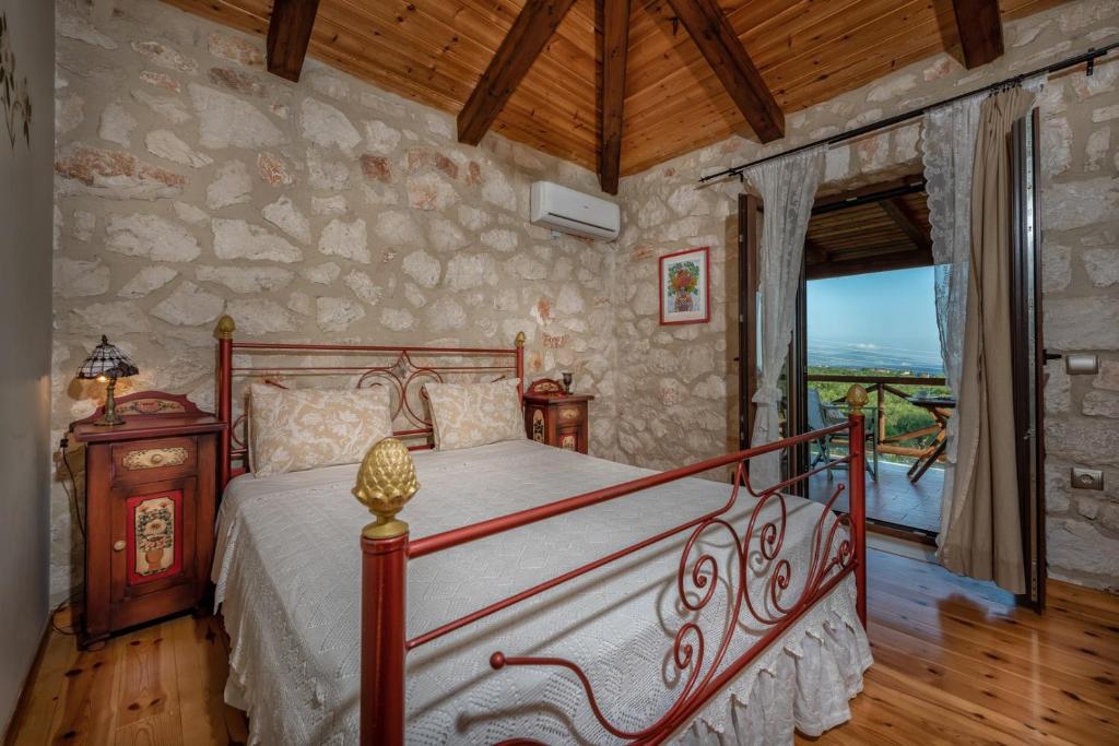 Postel nebo postele na pokoji v ubytování ORFEAS Villa