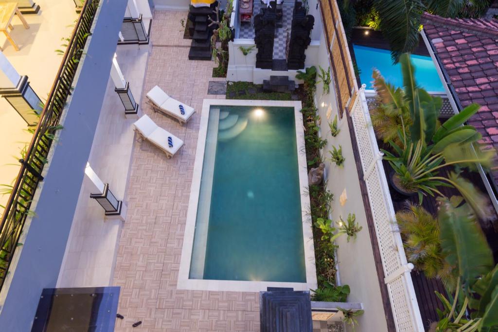 an overhead view of a swimming pool in a building at Amerta Seminyak in Seminyak