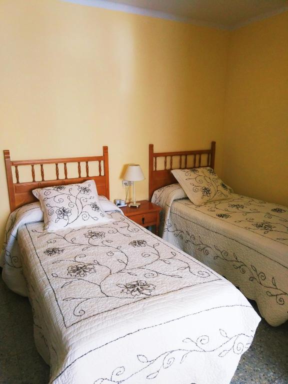 Postel nebo postele na pokoji v ubytování Hostal Vall d'Àssua