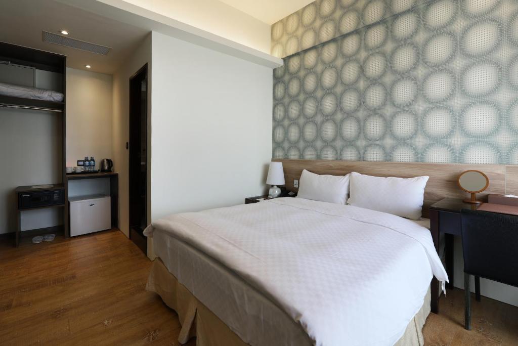 Postel nebo postele na pokoji v ubytování KUN Hotel