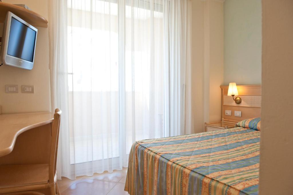 Postel nebo postele na pokoji v ubytování Hotel Derby Exclusive