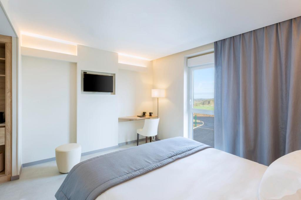 Postel nebo postele na pokoji v ubytování Best Western le Sémaphore