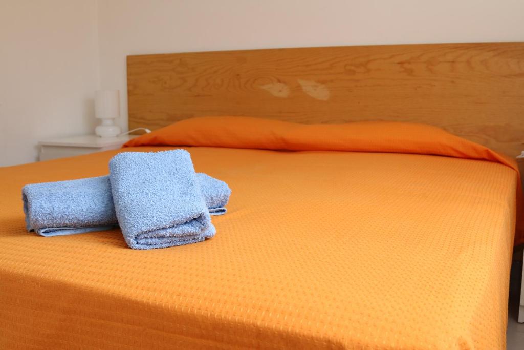 Postel nebo postele na pokoji v ubytování Rocca dei tramonti