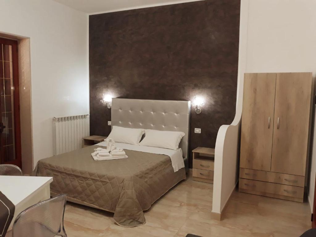 Giường trong phòng chung tại Il Vittoriano