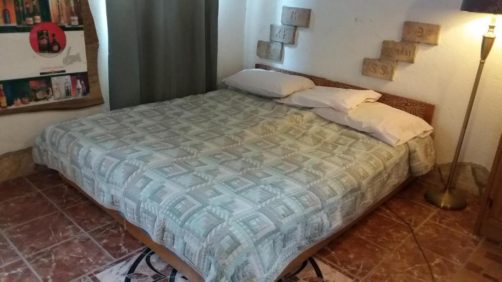Postel nebo postele na pokoji v ubytování Nicoláj Vendégház és Tanya