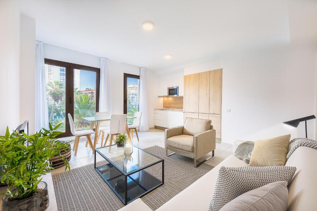 a living room with a couch and a table at Plaza de La Feria Premium Apartments in Las Palmas de Gran Canaria