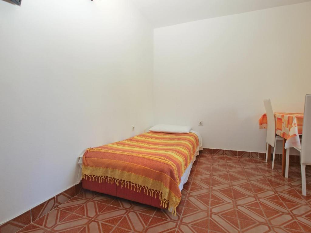 Łóżko lub łóżka w pokoju w obiekcie Apartments Kamenjak