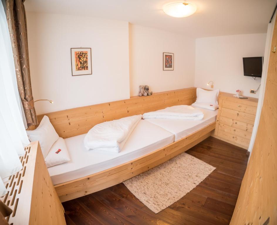Postel nebo postele na pokoji v ubytování Hotel Pra Tlusel
