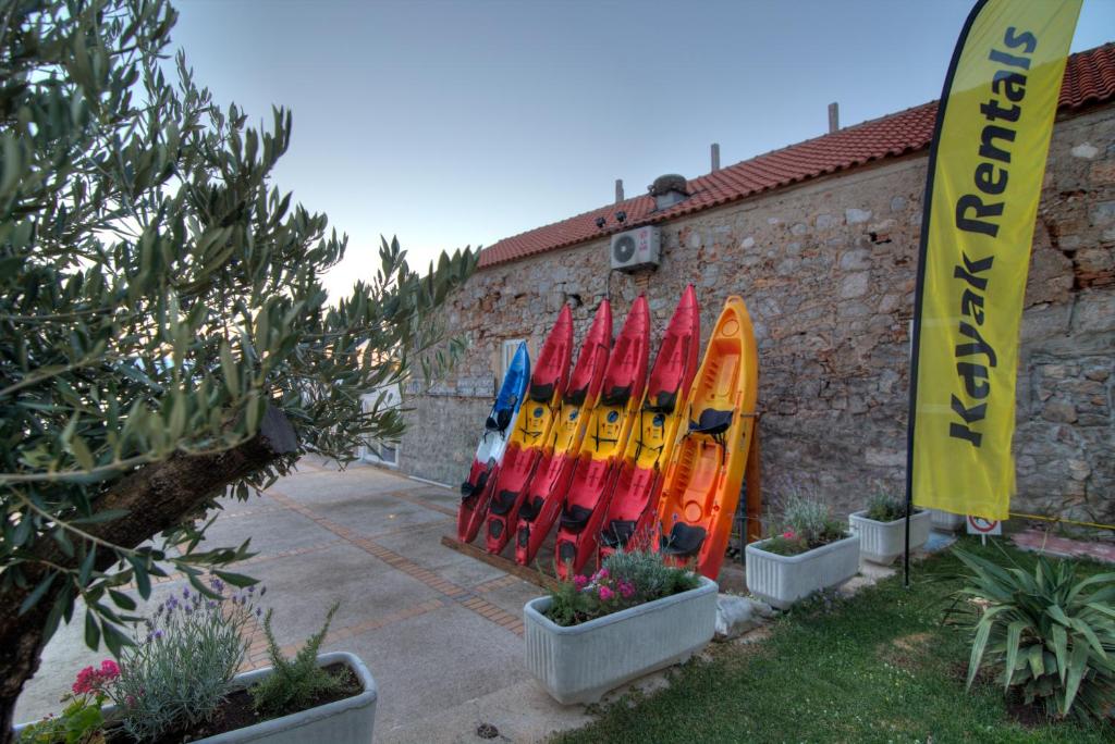a group of surfboards lined up against a building at Dida moj in Senj