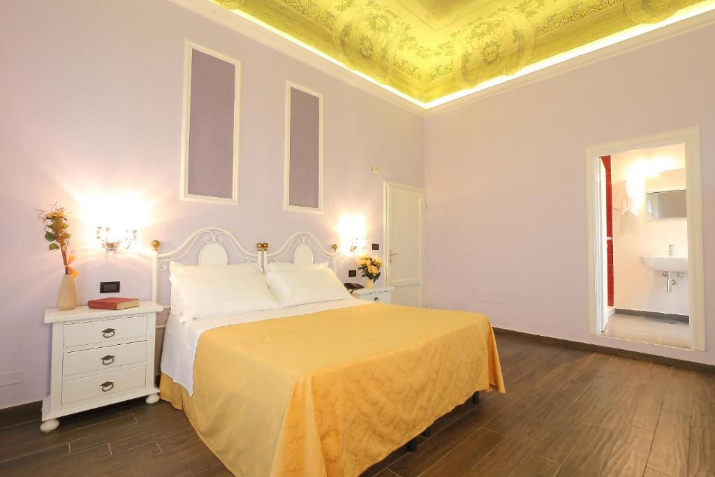 Postel nebo postele na pokoji v ubytování Hotel Ferrucci