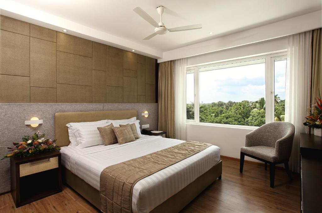 Postel nebo postele na pokoji v ubytování Sugar Business Hotel