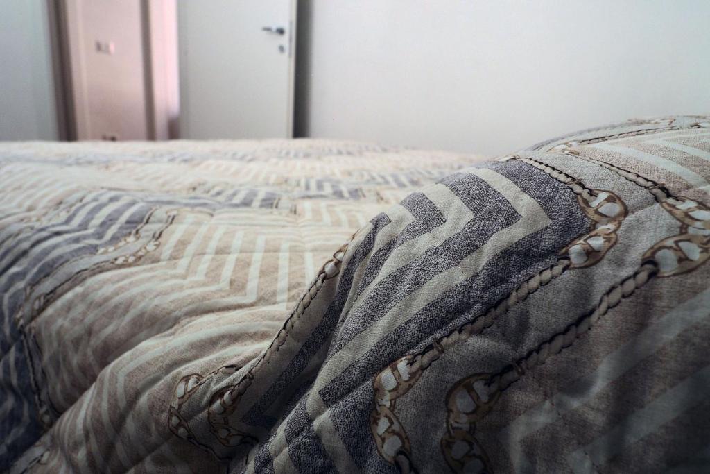 Postel nebo postele na pokoji v ubytování Marina Apartments