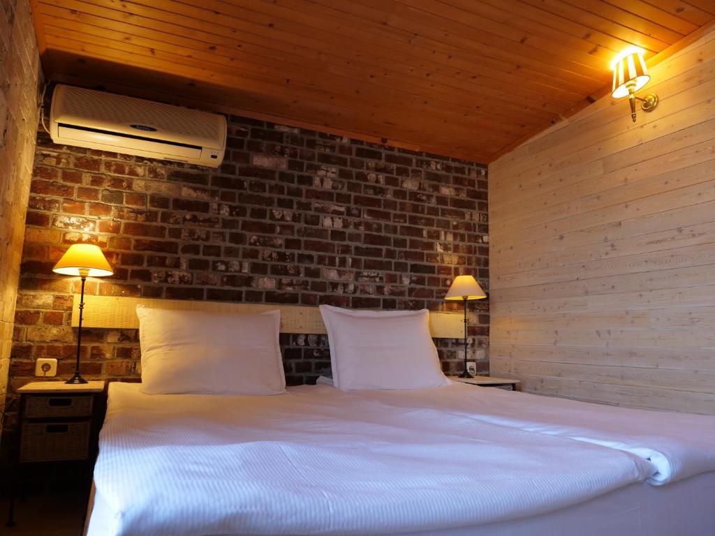 Postel nebo postele na pokoji v ubytování Hotel Anchor