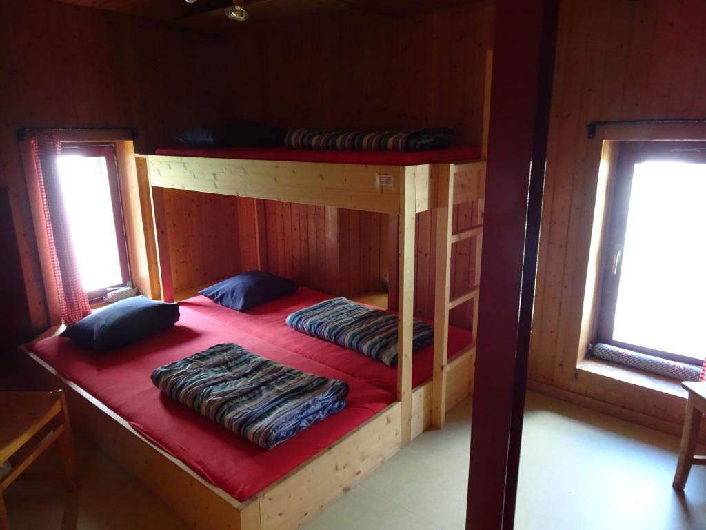 Postel nebo postele na pokoji v ubytování Hostel im Oltä Stall