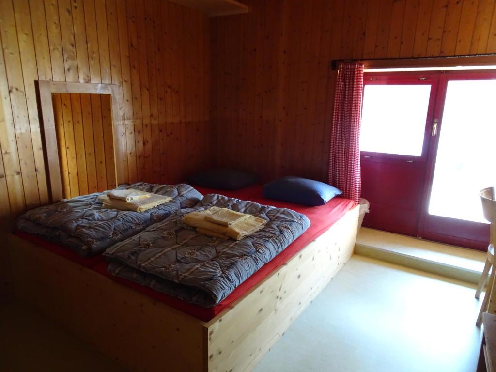 Postel nebo postele na pokoji v ubytování Hostel im Oltä Stall