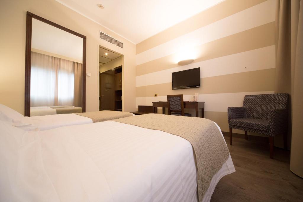 Posteľ alebo postele v izbe v ubytovaní Hotel Motel Ascot