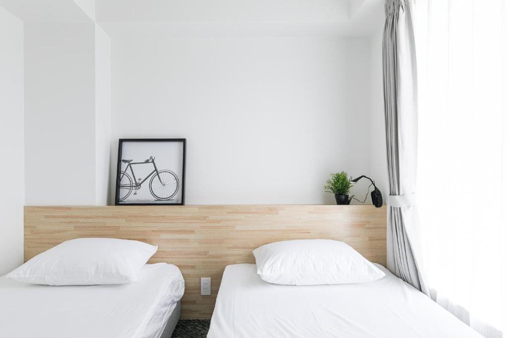 Postel nebo postele na pokoji v ubytování Imu Hotel Kyoto