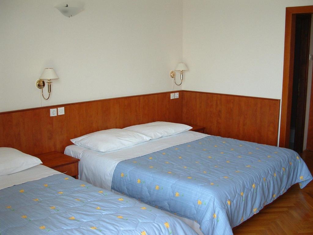 Posteľ alebo postele v izbe v ubytovaní Apartments Mladina