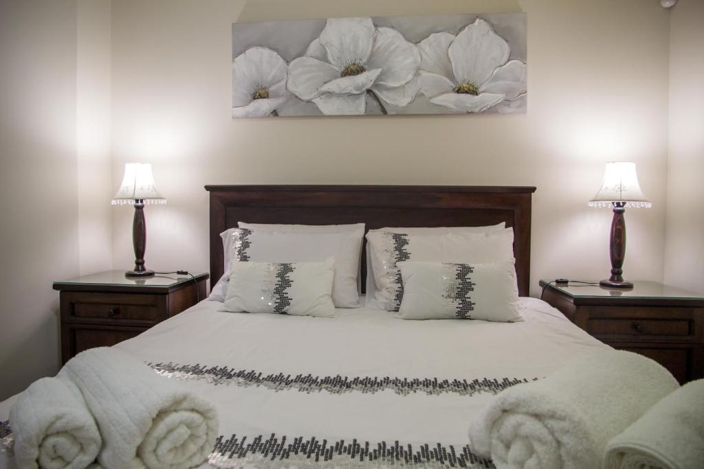 Llit o llits en una habitació de Sand & Sea Holiday Home