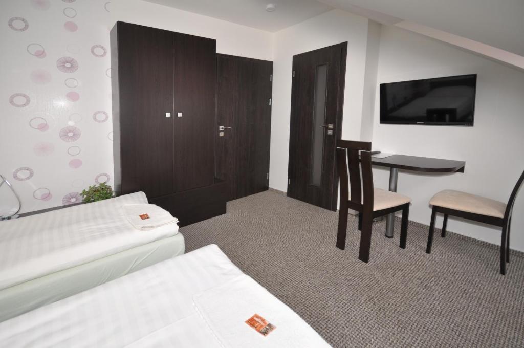 Postel nebo postele na pokoji v ubytování Hotel Jordánek
