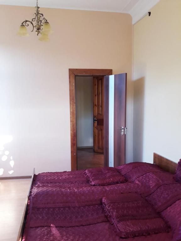 Postel nebo postele na pokoji v ubytování Malkhazi's Guesthouse