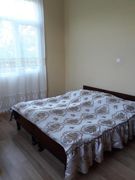 Postel nebo postele na pokoji v ubytování Malkhazi's Guesthouse