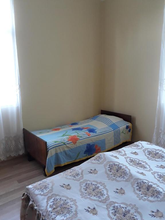 Postel nebo postele na pokoji v ubytování Malkhazi's Guesthouse
