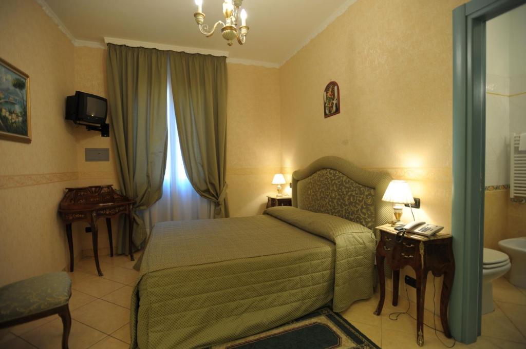 Postel nebo postele na pokoji v ubytování Hotel Ristorante Amitrano