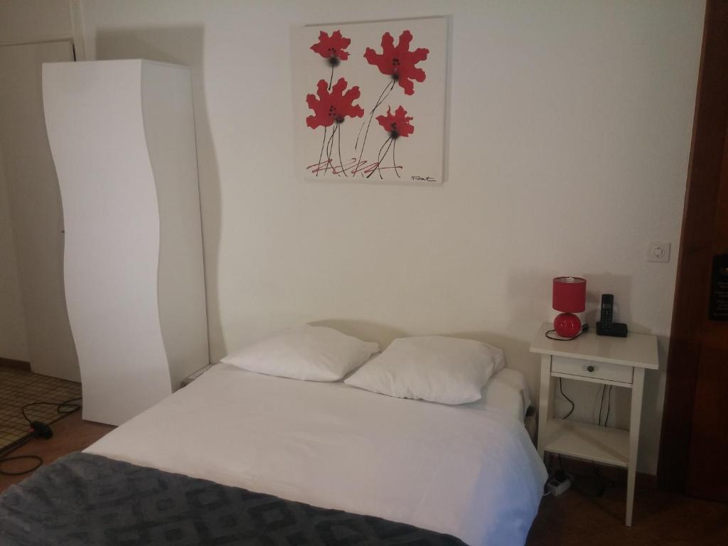Postel nebo postele na pokoji v ubytování Appart'Hôtel Residence Dizerens