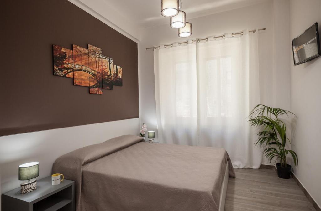 Posteľ alebo postele v izbe v ubytovaní Ajana Rooms by Accomodo