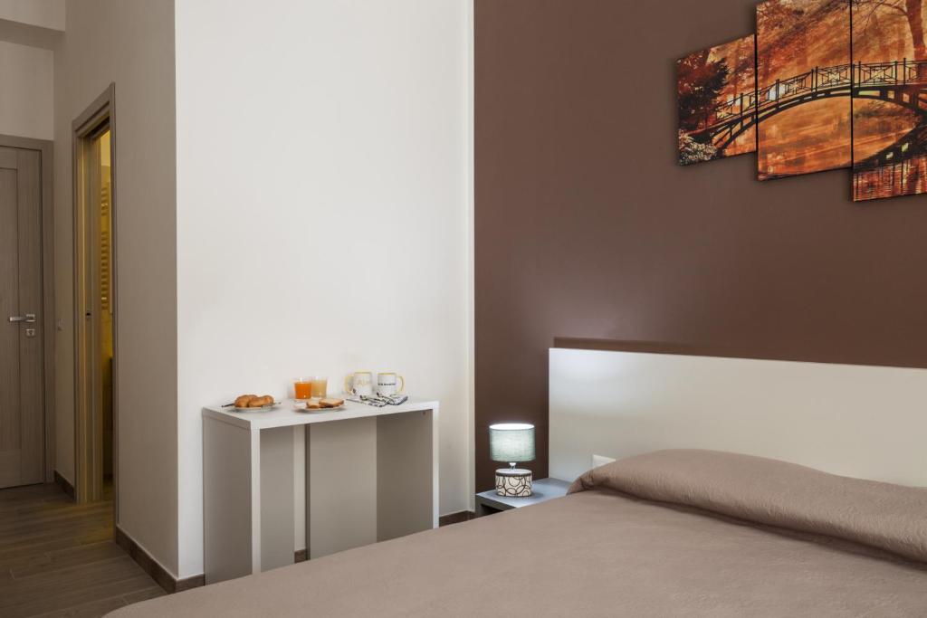 Posteľ alebo postele v izbe v ubytovaní Ajana Rooms by Accomodo