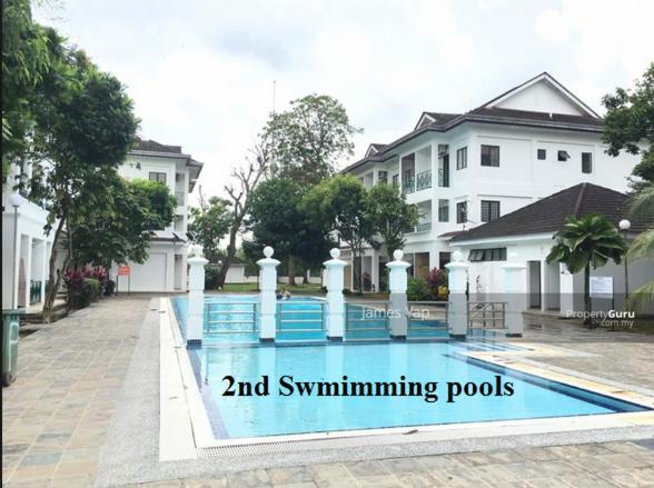 a swimming pool in front of a house at Polo Park Resort Condominium in Johor Bahru