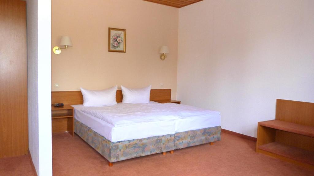 Postel nebo postele na pokoji v ubytování Hotel Mühlenhof