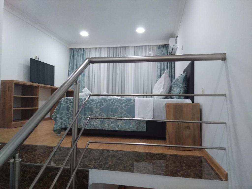 Postel nebo postele na pokoji v ubytování Dzveli Batumi