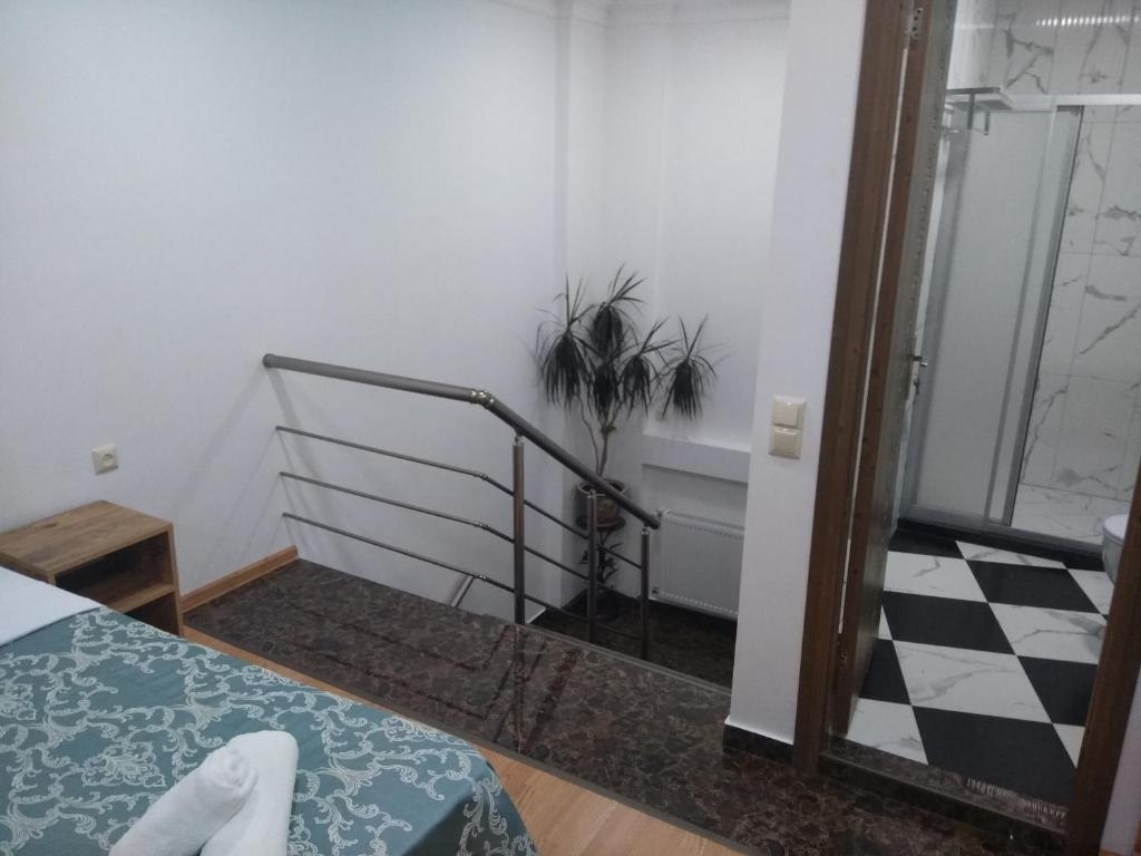 Postel nebo postele na pokoji v ubytování Dzveli Batumi