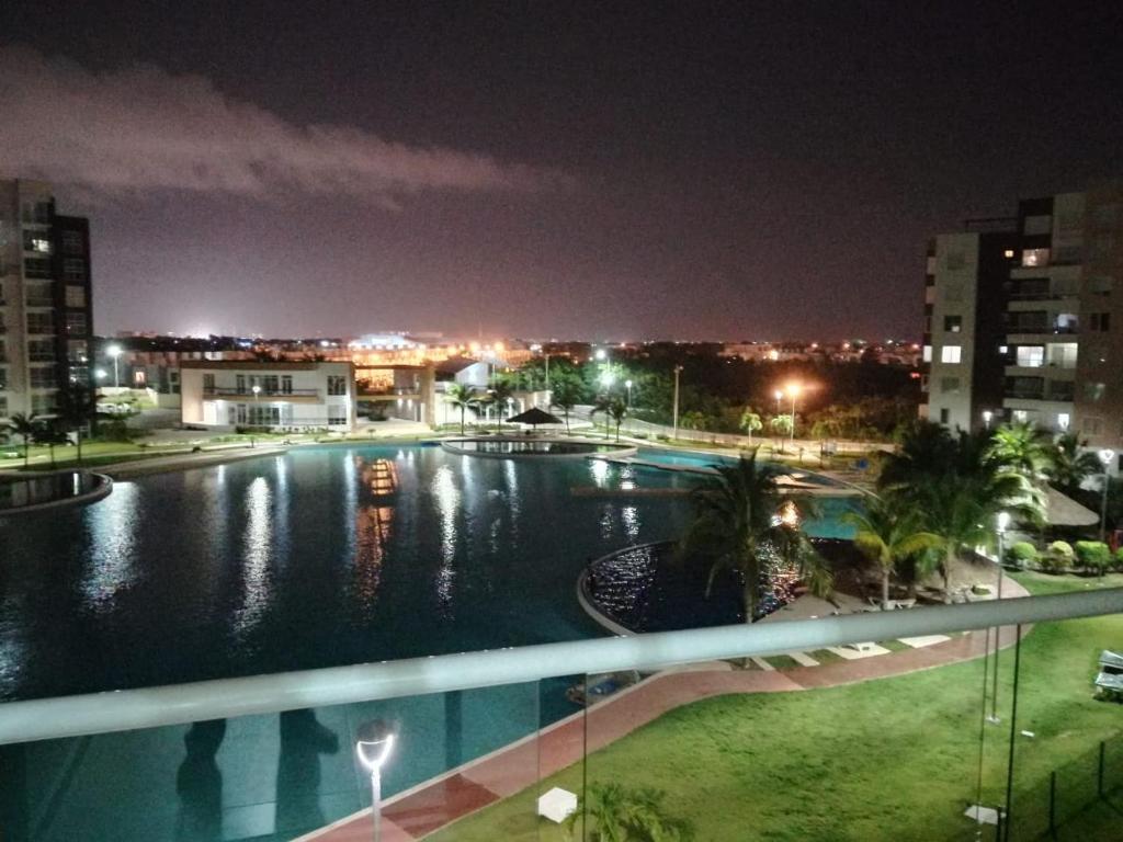 a view of a swimming pool at night at Departamento en Dream Lagoons Cancun in Cancún