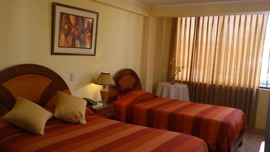 Postel nebo postele na pokoji v ubytování Copacabana Hotel