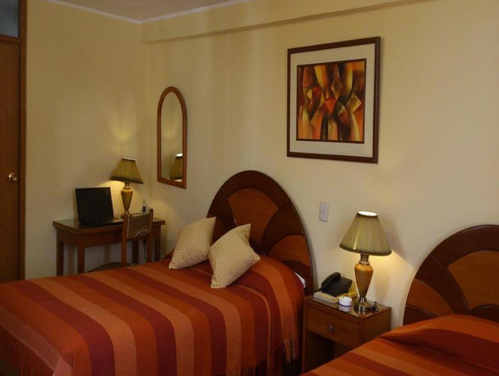 Postel nebo postele na pokoji v ubytování Copacabana Hotel