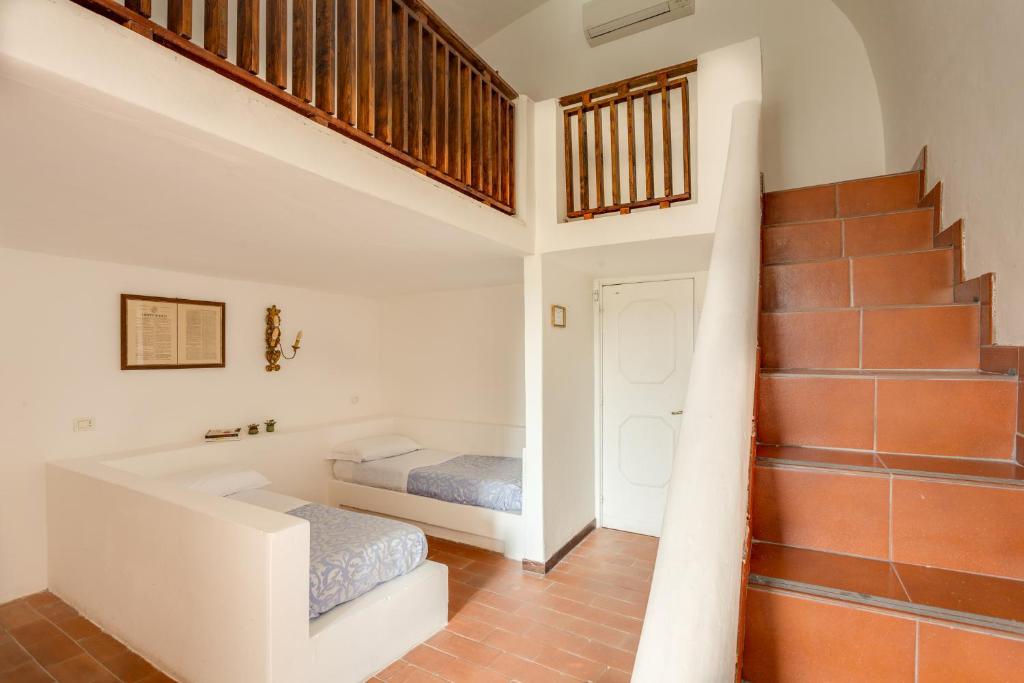 Postel nebo postele na pokoji v ubytování Hotel Torre Dei Borboni