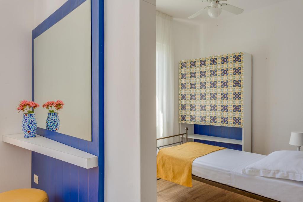 Postel nebo postele na pokoji v ubytování Hotel Torre Dei Borboni