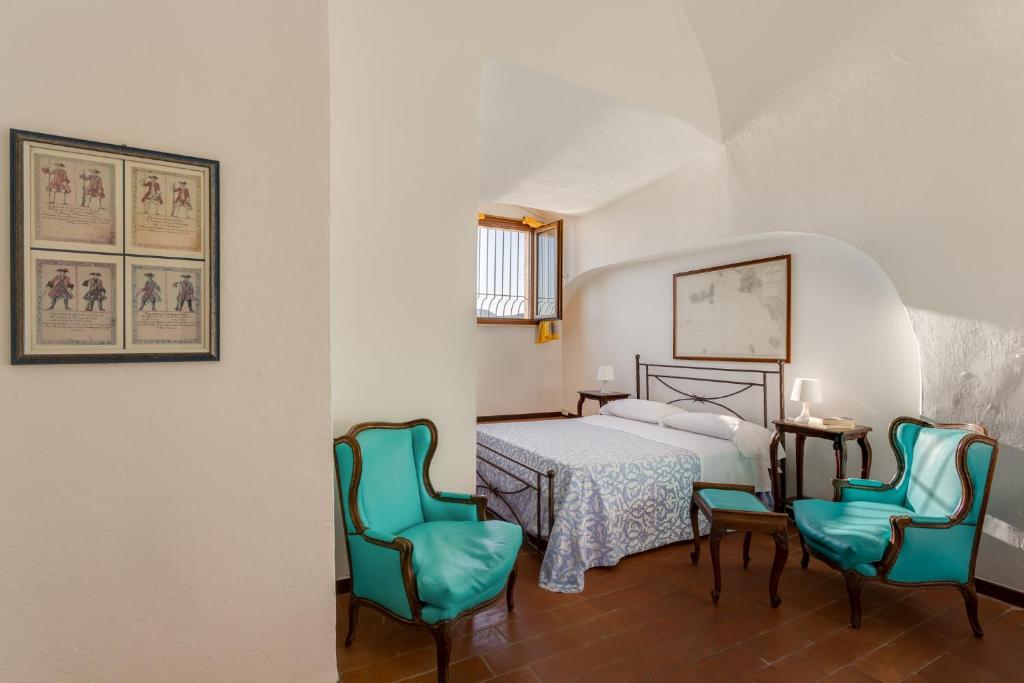Postel nebo postele na pokoji v ubytování Hotel Torre Dei Borboni