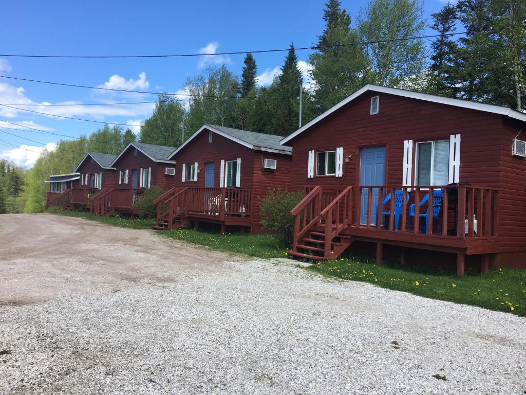 a row of houses in a row on a street at Lush's Cottages in Cormack