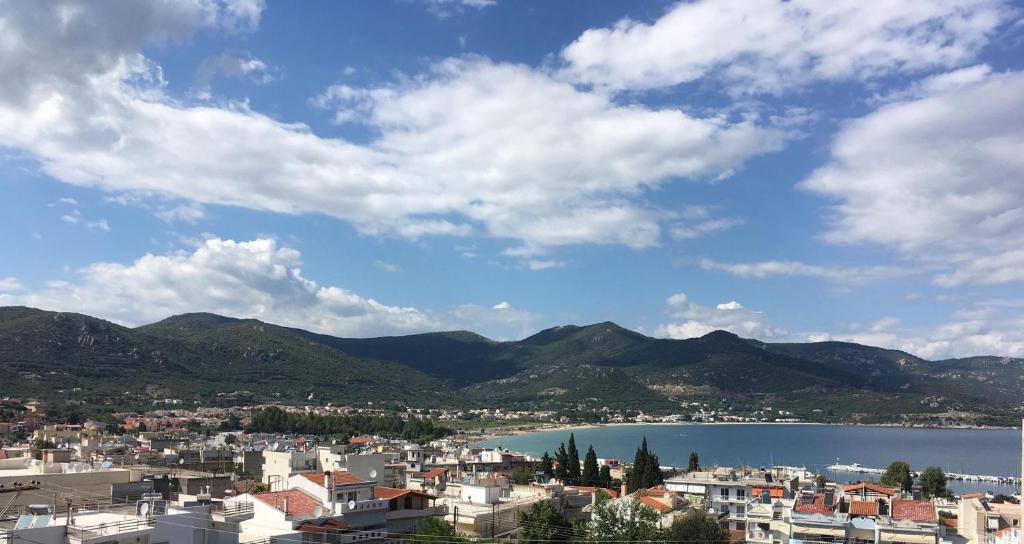 a view of a city and a body of water at Luxury View in Iraklitsa