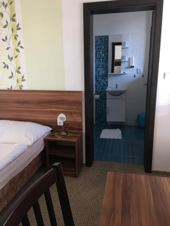 Postel nebo postele na pokoji v ubytování Hotel Jordánek