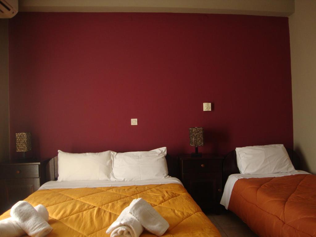 Postel nebo postele na pokoji v ubytování Kafiona Guesthouse