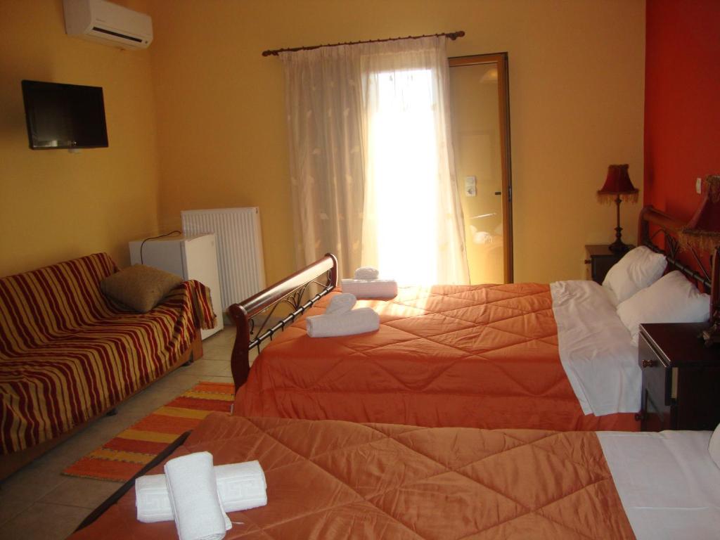 Postel nebo postele na pokoji v ubytování Kafiona Guesthouse