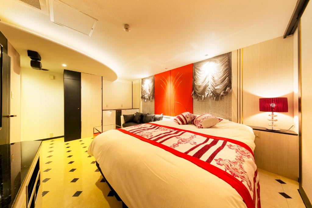 Postel nebo postele na pokoji v ubytování Hotel Eldia Modern Kobe(Adult Only)