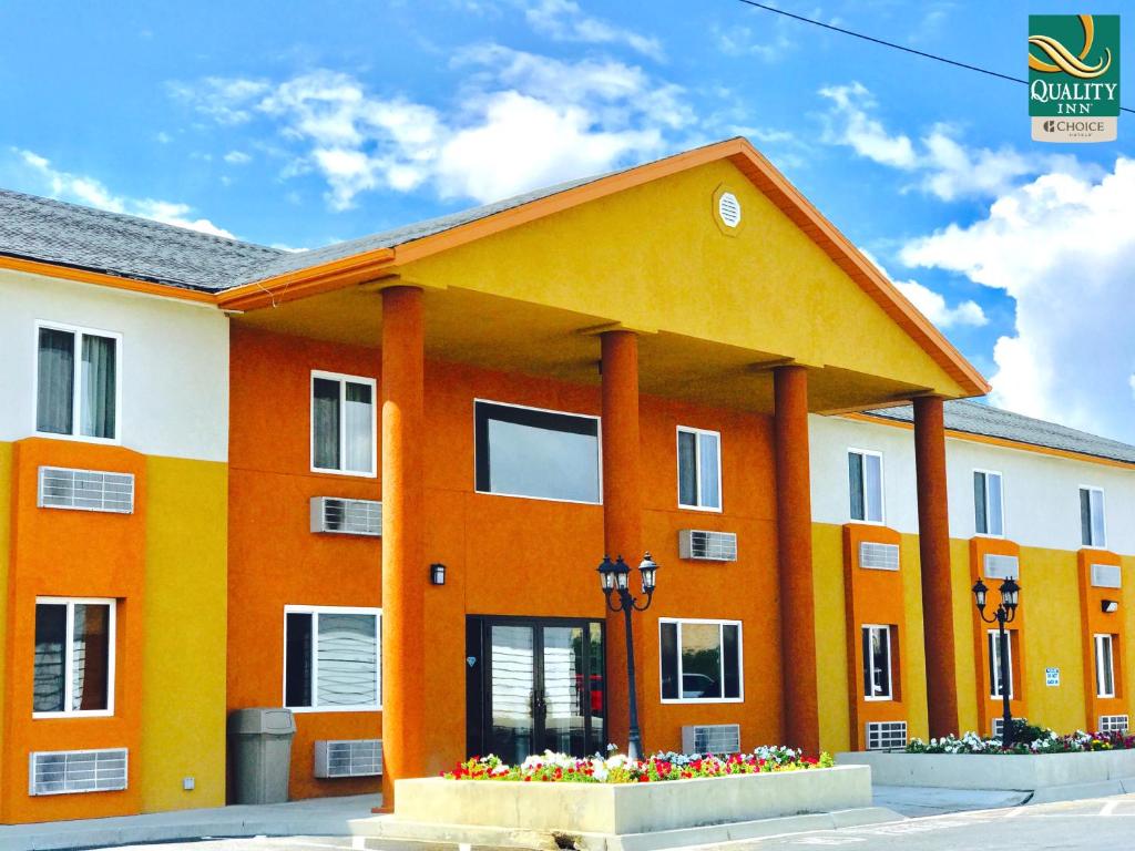an orange and white building with columns at Quality Inn Price Gateway to Moab National Parks in Price
